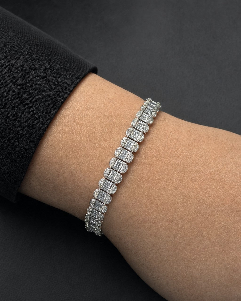 Male model wearing 14K Rounded Rectangle Link Diamond Baguette Bracelet 7mm