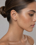 Female model wearing 14K Clover Diamond Earrings