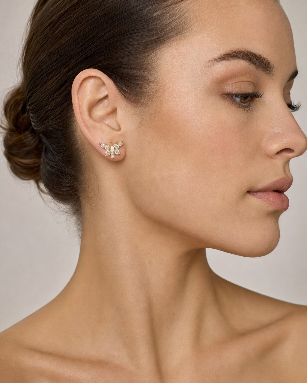Female model wearing 14K Butterfly Diamond Baguette Earrings