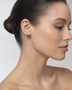 Female model wearing 14K Purple Butterfly Diamond Earrings
