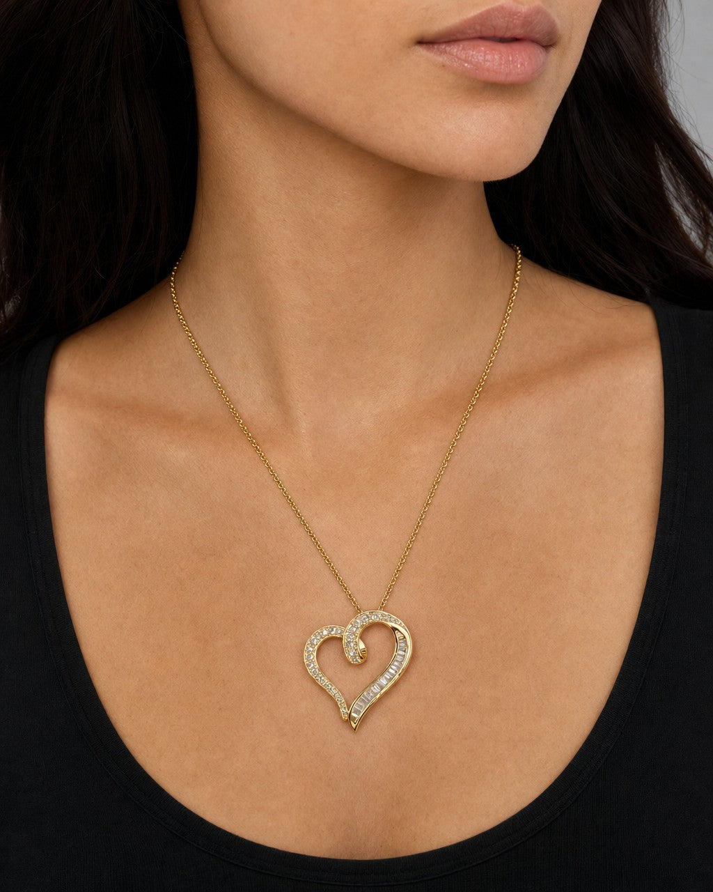 Female model wearing 14K Ribbon Heart Diamond Baguette Pendant