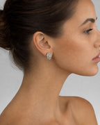 Female model wearing 14K Large Oval Stacked Diamond Baguette Earrings