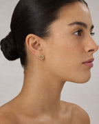 Female model wearing 14K Rose Flower Diamond Earrings