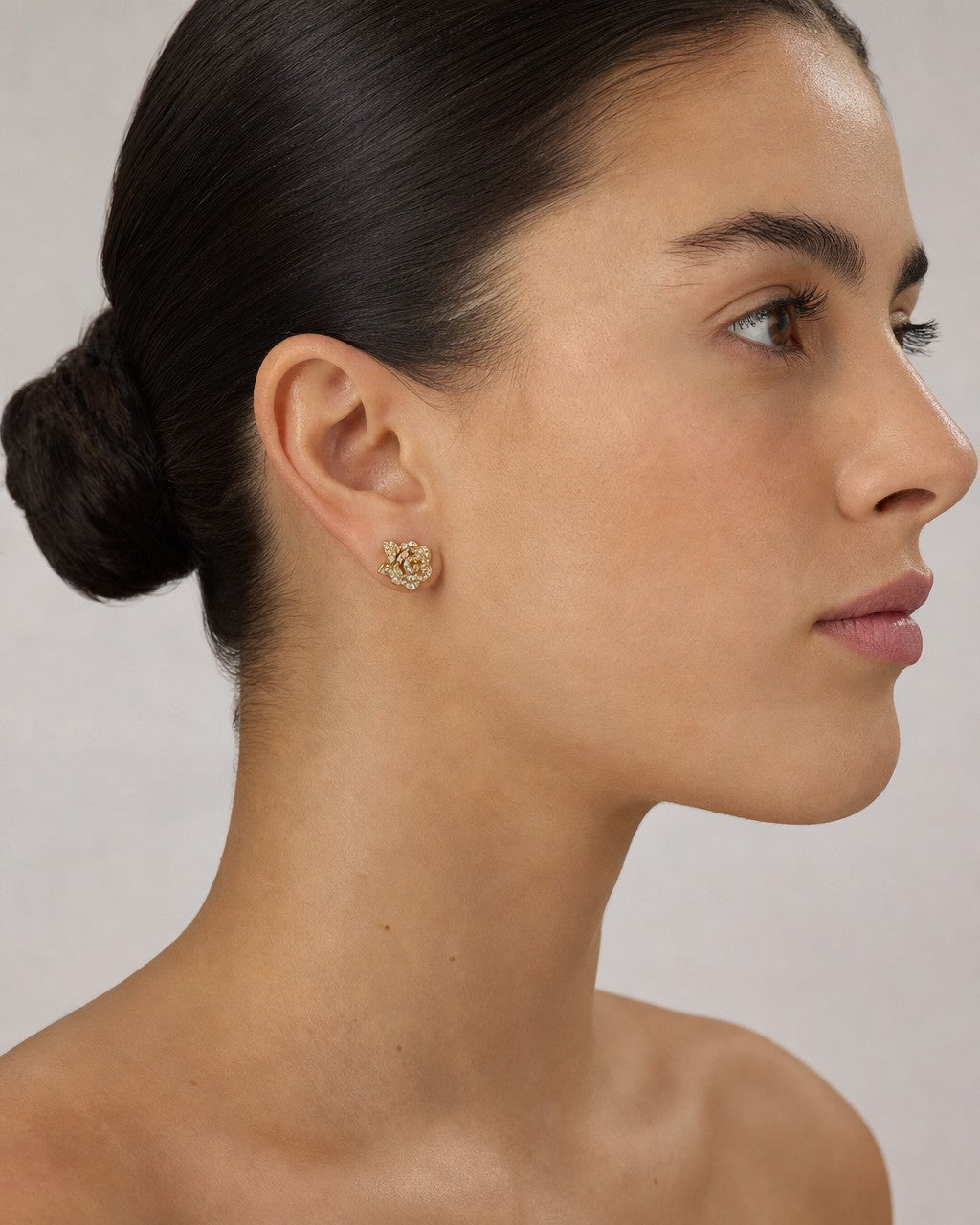 Female model wearing 14K Rose Flower Diamond Earrings