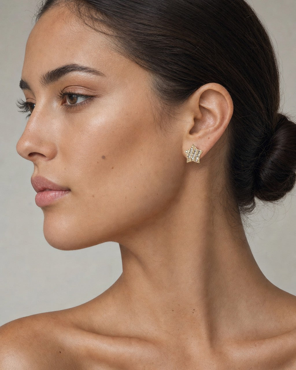 Female model wearing 14K Star Stacked Diamond Baguette Earrings