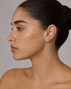 Female model wearing 14K Circle Diamond Baguette Earrings
