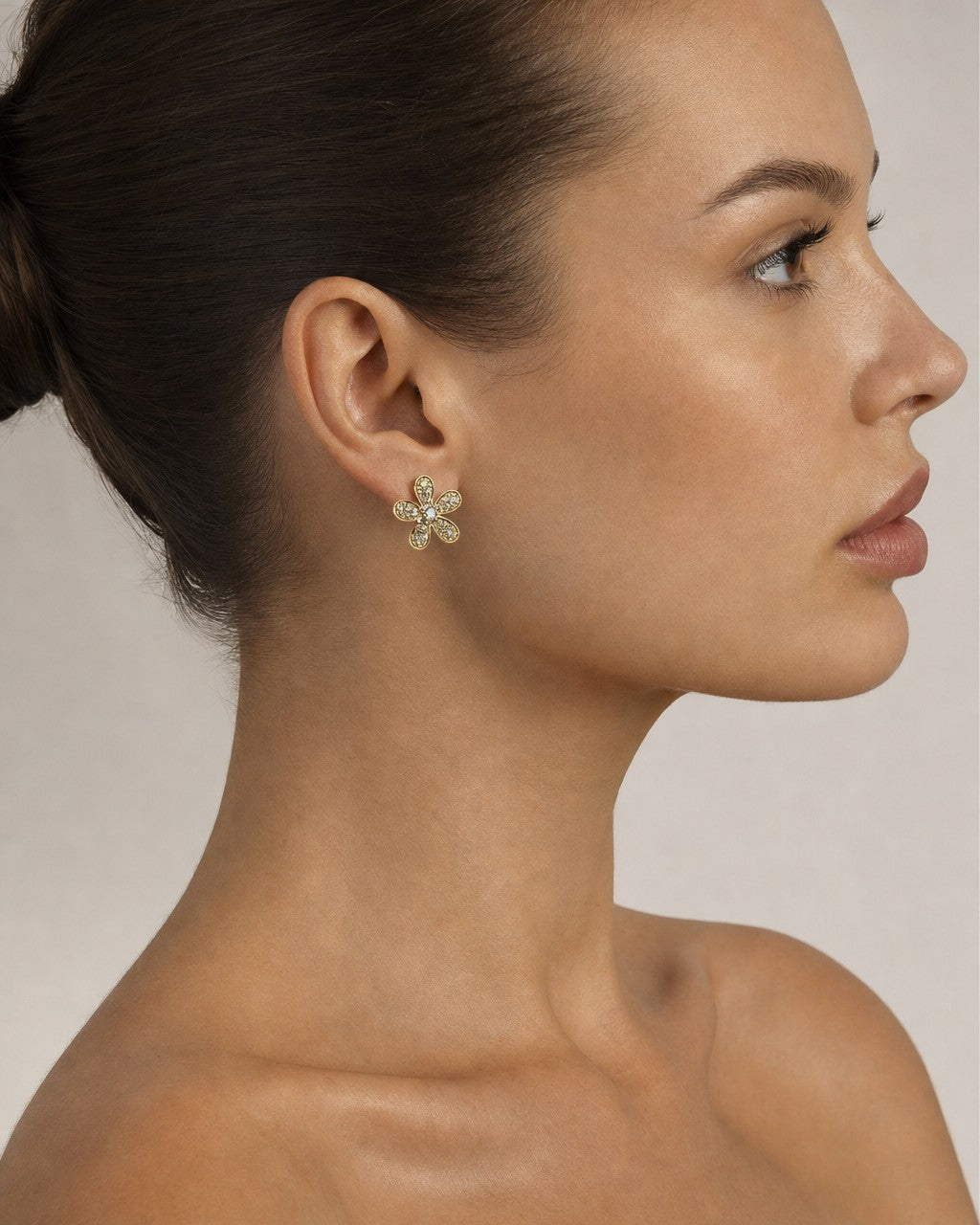Female model wearing 14K Daisy Flower Diamond Earrings
