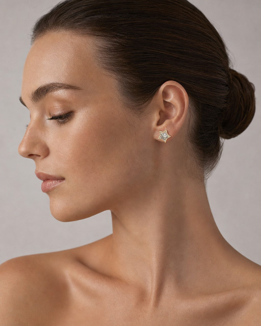 Female model wearing 14K 3D Star Diamond Earrings