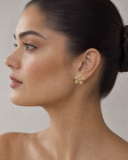 Female model wearing 14K Flower Baguette Diamond Earrings