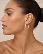 Female model wearing Bamboo Earrings 1.5”