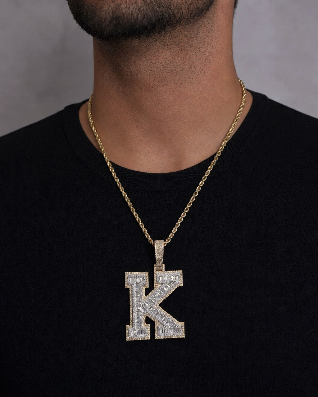 Male model wearing 10K Initial K Diamond Baguette Pendant