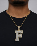 Male model wearing 10K Initial F Diamond Baguette Pendant