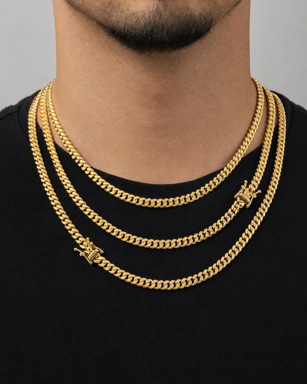 Male model wearing 14K 5.2MM Solid Miami Cuban Link Chain 22-26"
