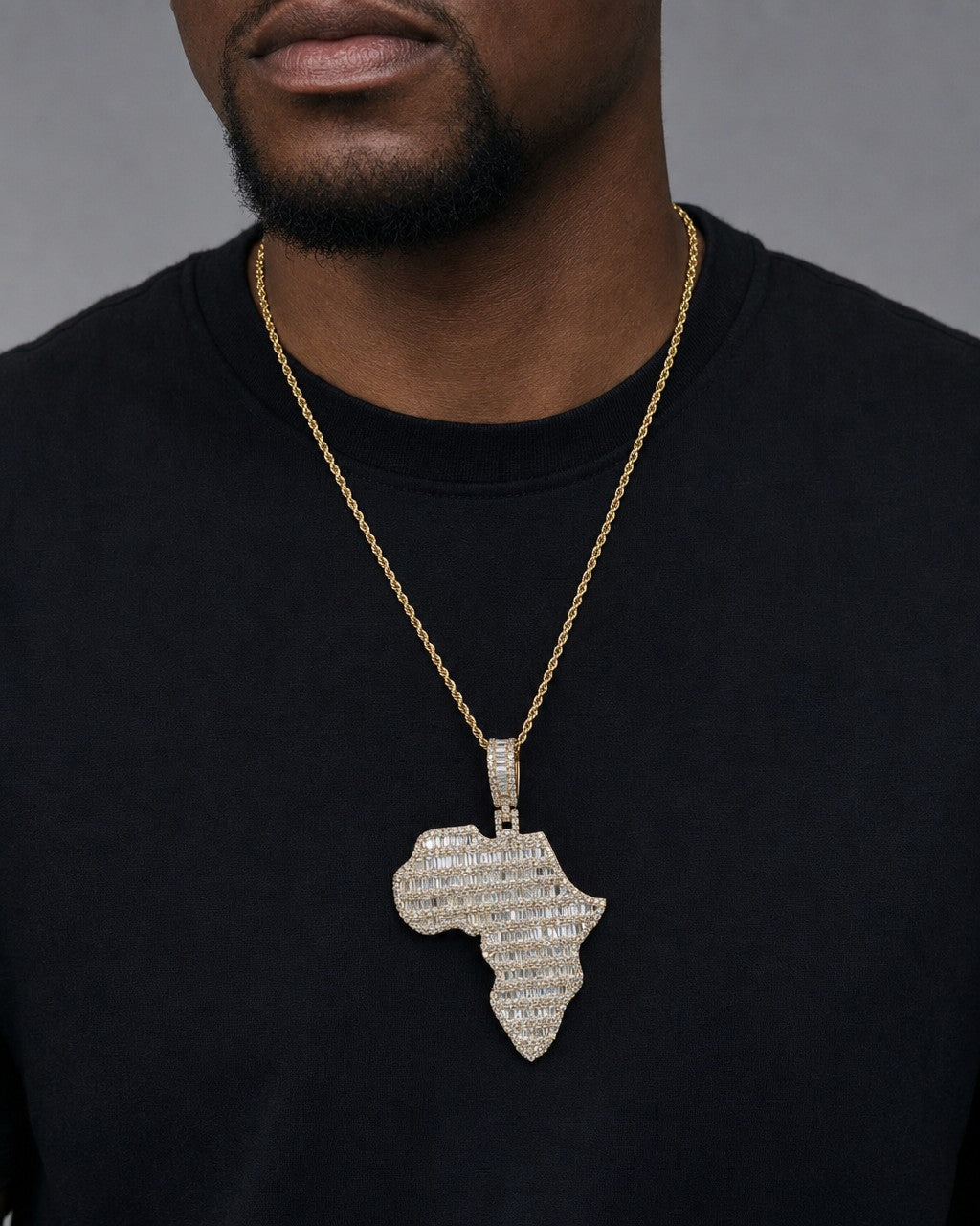 Male model wearing 10K Africa Diamond Baguette Pendant