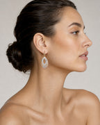 Female model wearing 14K Gold Oval Hanging Earrings