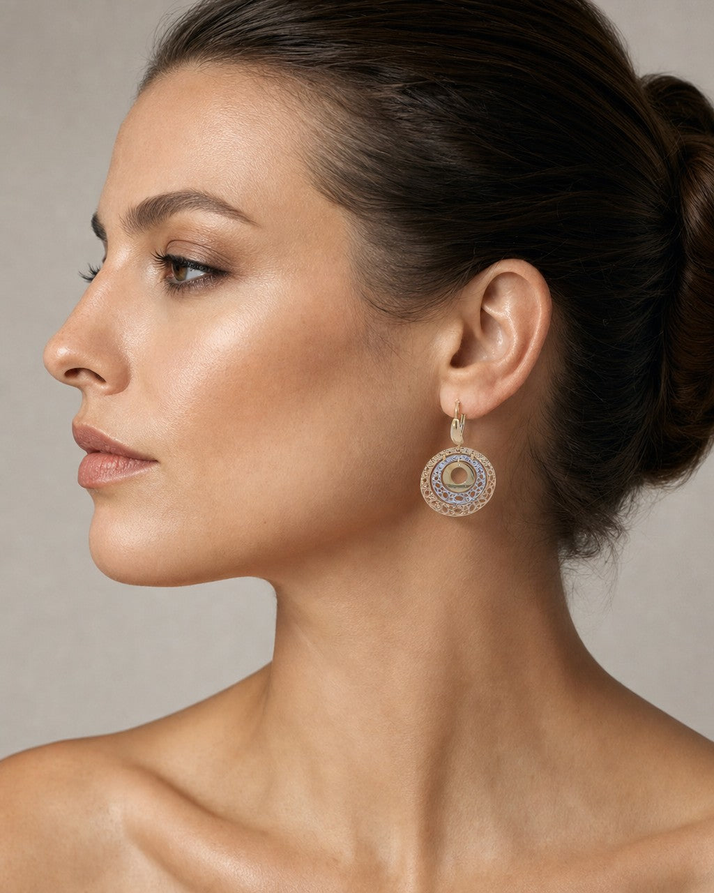 Female model wearing 14K Gold Circle Hanging Earrings