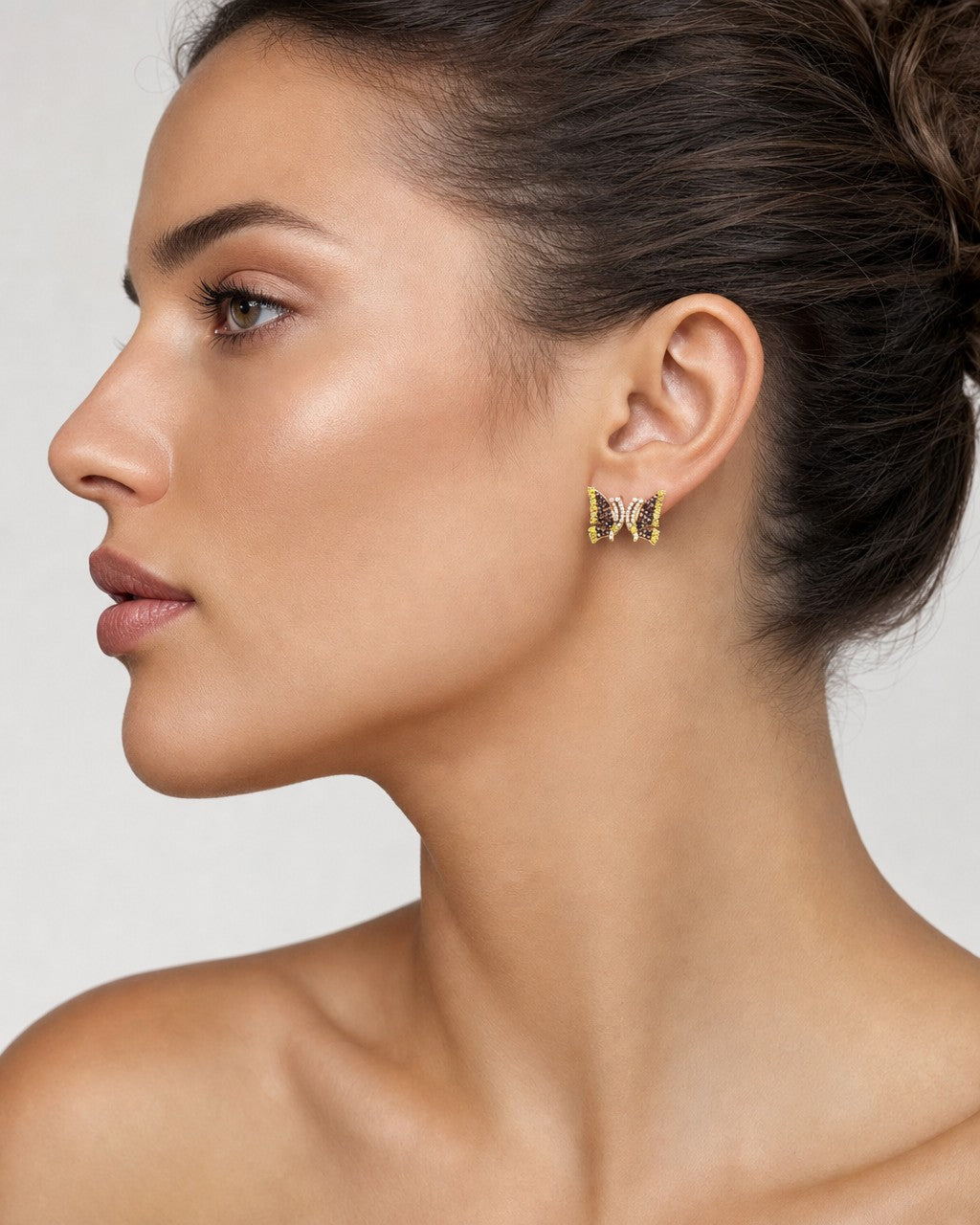 Female model wearing 14K Large Butterfly Diamond Earrings