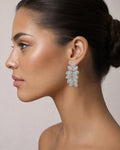 Female model wearing 14K Marquise Hanging Diamond Baguette Earrings