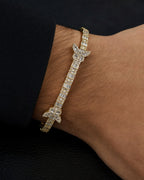 Male model wearing 10K Bangle Butterfly Diamond Baguette Bracelet