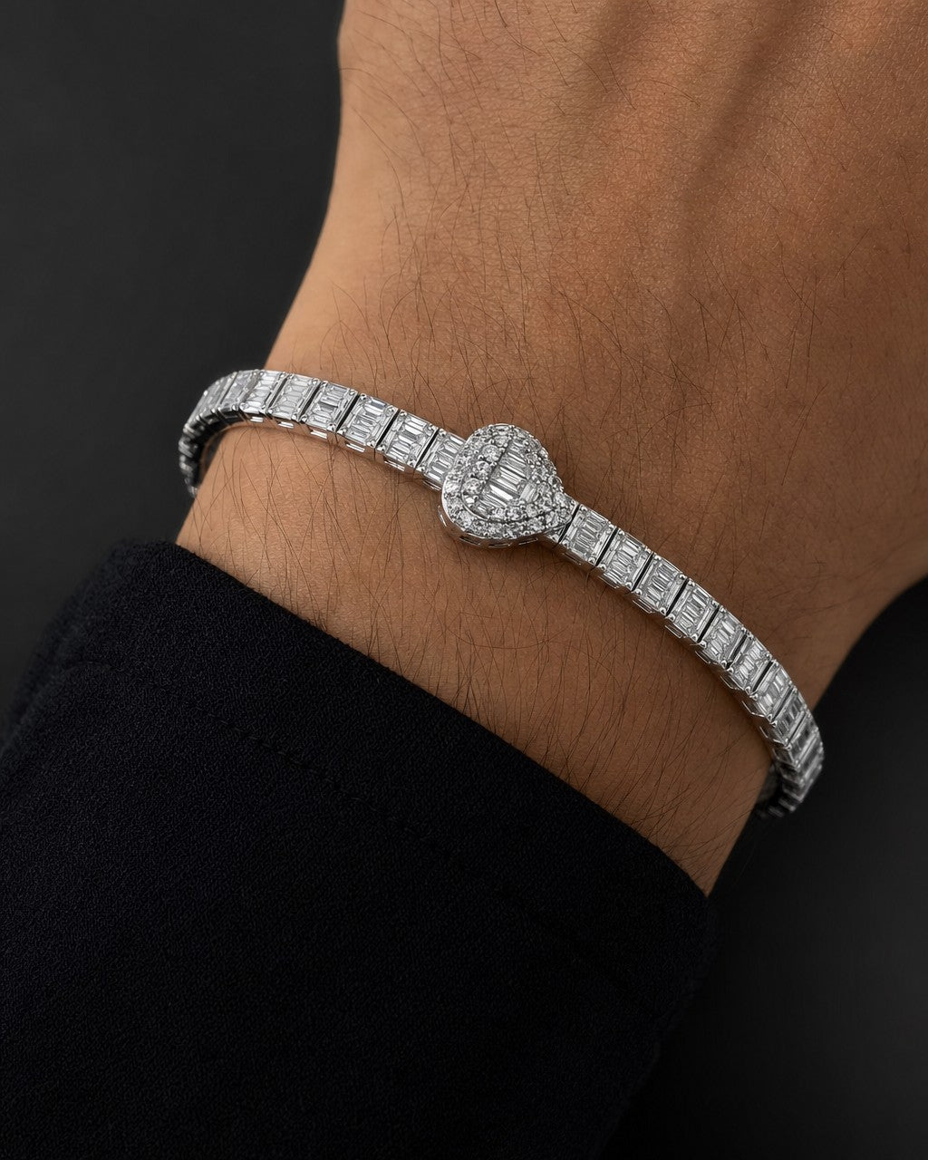Male model wearing 10K Bangle Heart Diamond Baguette Bracelet