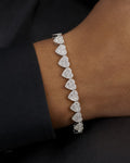 Male model wearing 10K 9MM Heart Diamond Baguette Bracelet 7.5"