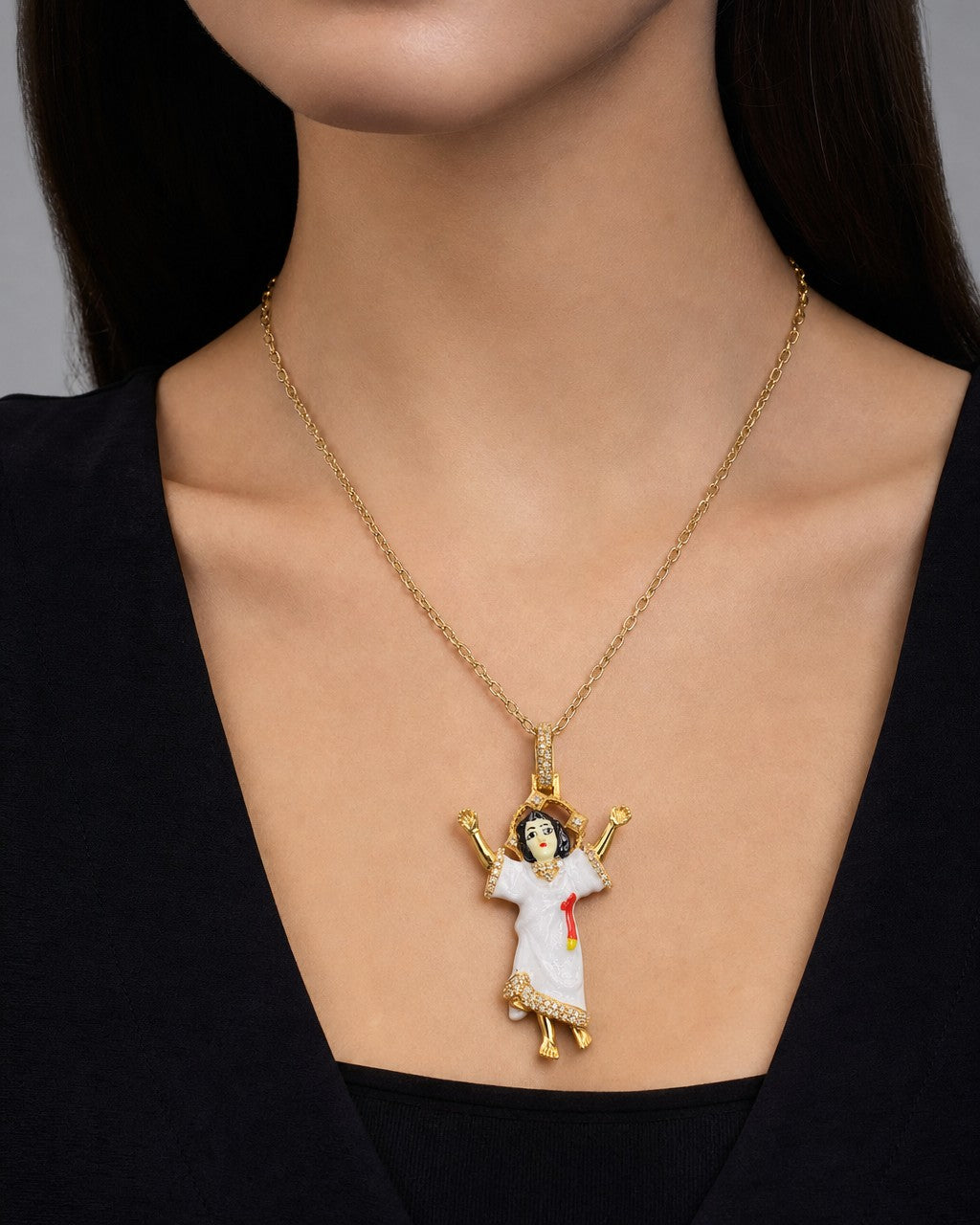 Female model wearing 14K Baby Jesus Enamel Diamond Pendant