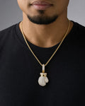 Male model wearing 14K Boxing Glove Diamond Pendant