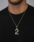Male model wearing 14k Number 2 Diamond Pendant