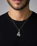 Male model wearing 14k Number 4 Diamond Pendant