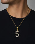 Male model wearing 14k Number 5 Diamond Pendant