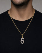 Male model wearing 14K Number 6 Diamond Pendant