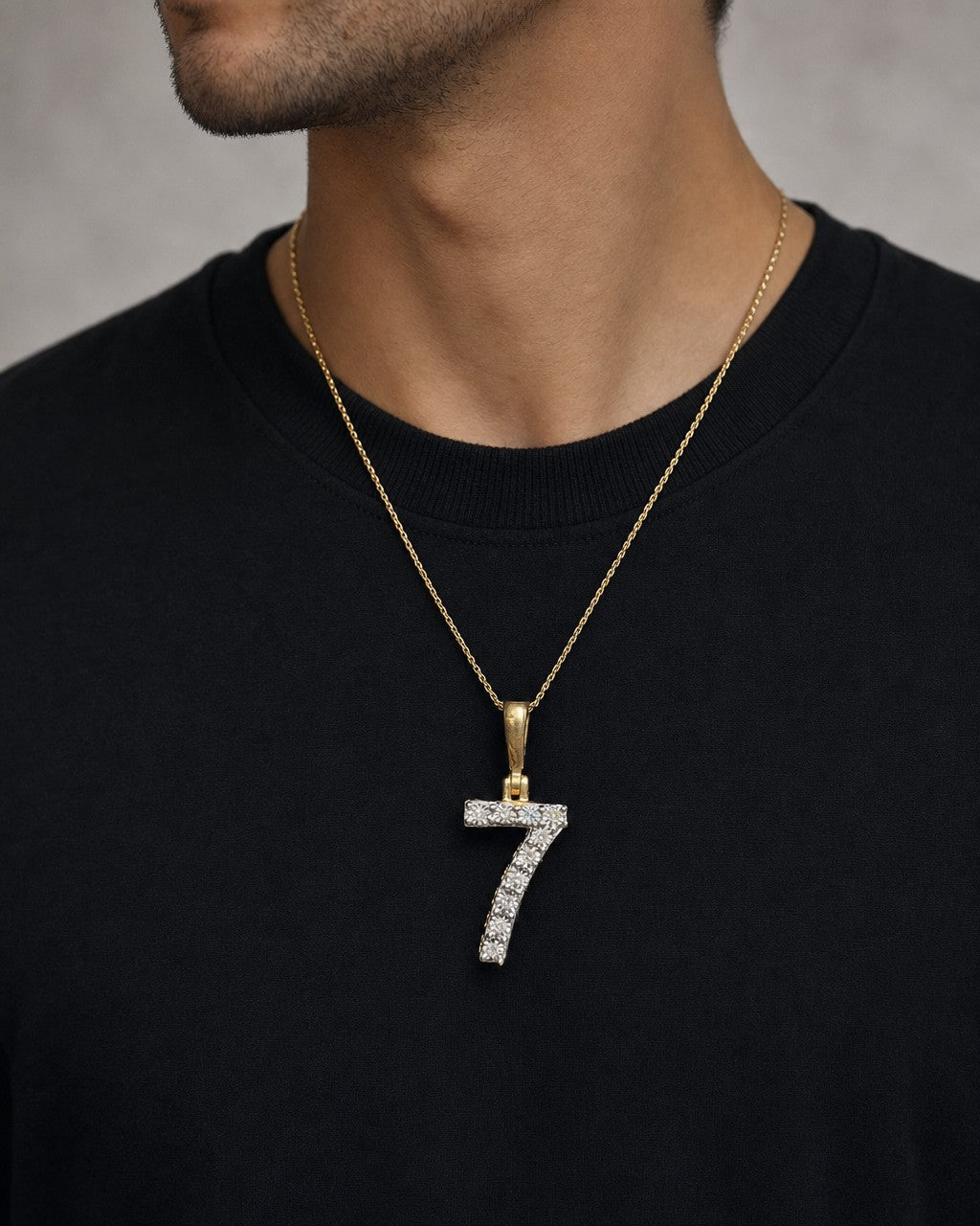 Male model wearing 14k Number 7 Diamond Pendant