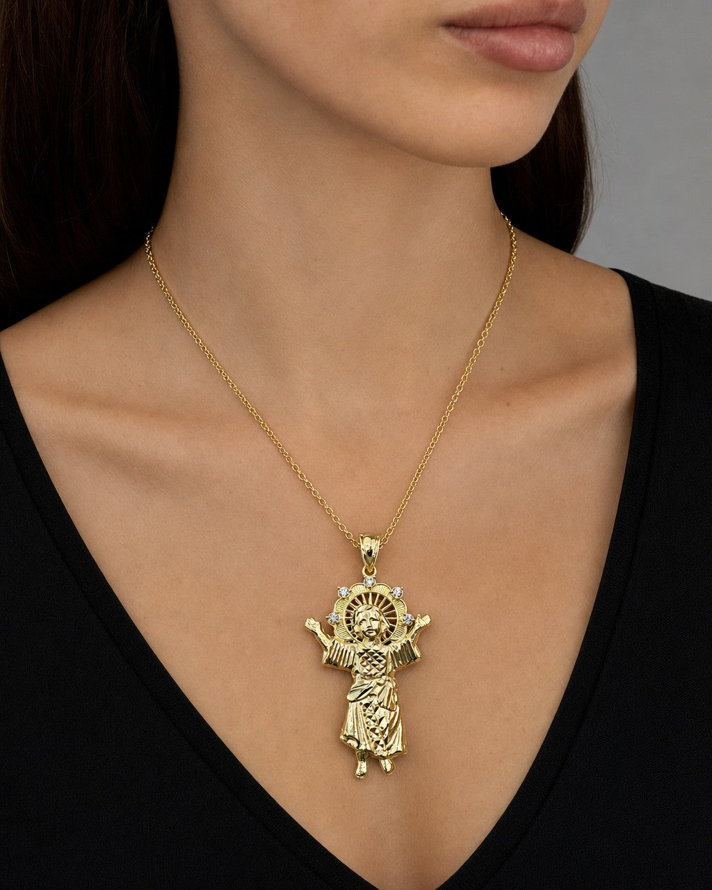 Female model wearing 14K Baby Jesus Pendant 1.8"