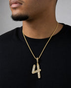 Male model wearing 14k Number 4 Diamond Baguette Pendant