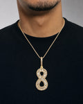 Male model wearing 14k Number 8 Diamond Baguette Pendant