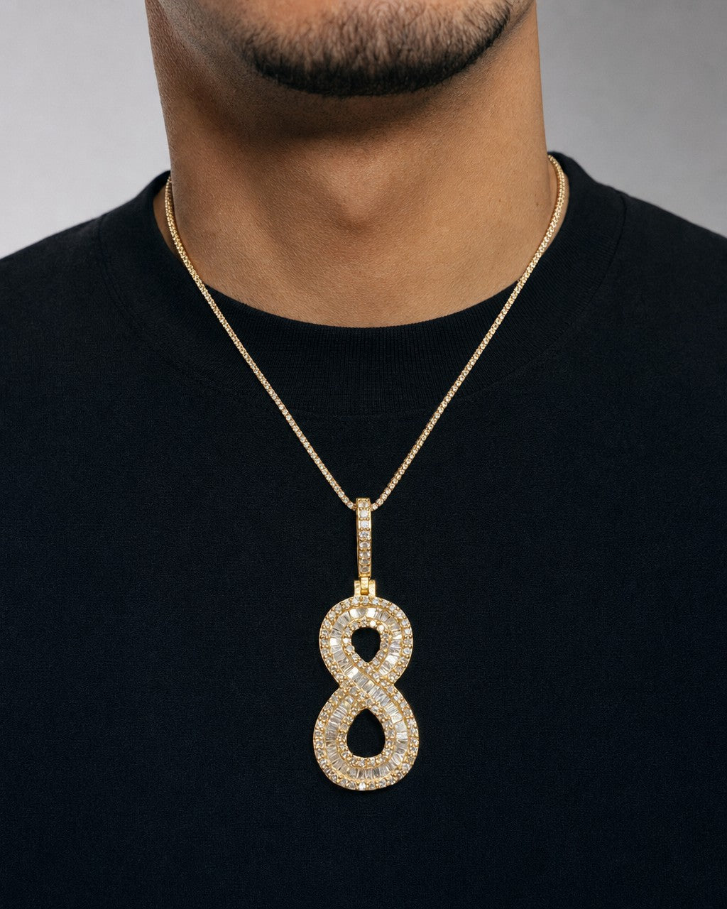 Male model wearing 14k Number 8 Diamond Baguette Pendant
