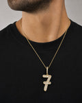 Male model wearing 14k Number 7 Diamond Baguette Pendant