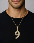 Male model wearing 14k Number 9 Diamond Baguette Pendant