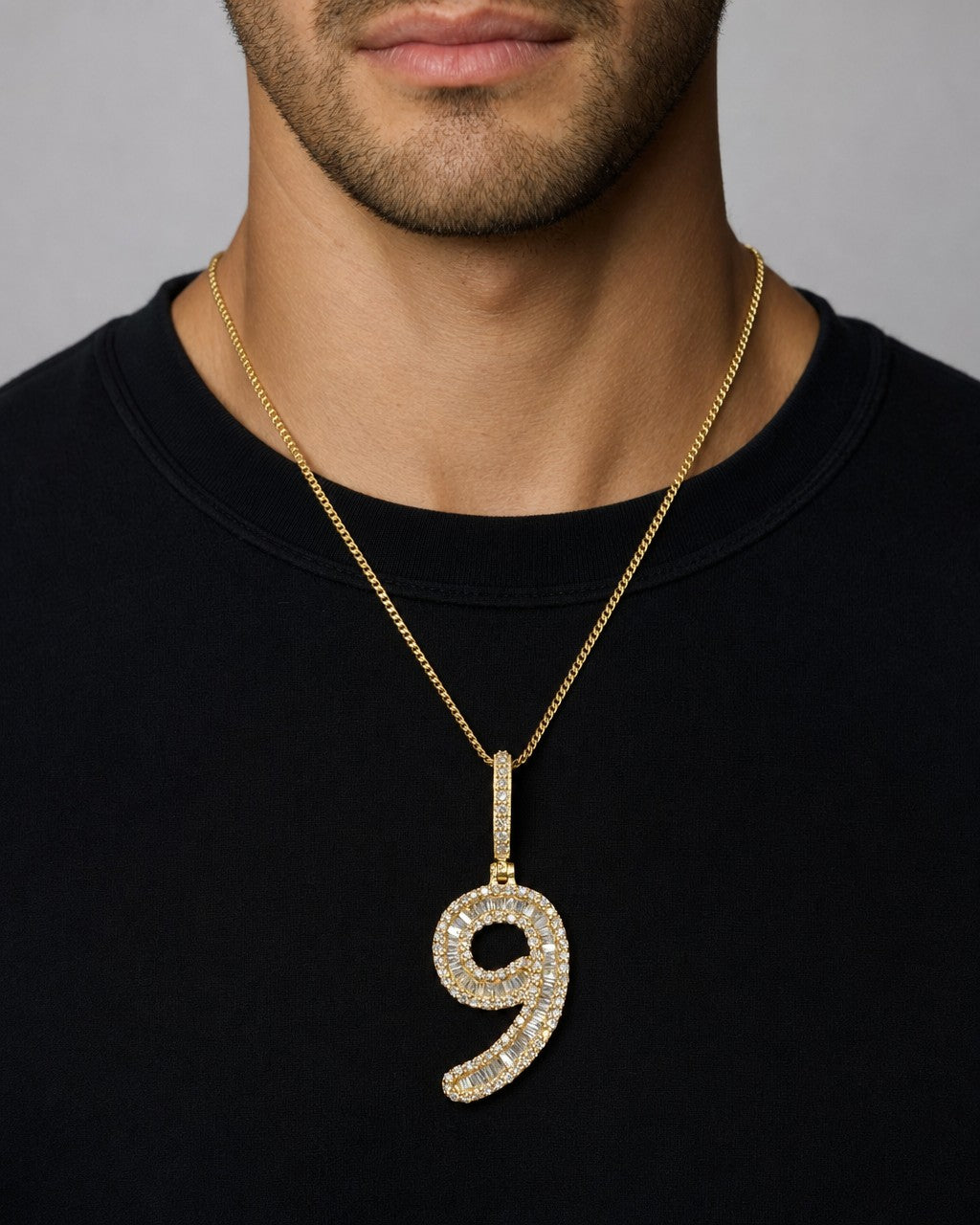 Male model wearing 14k Number 9 Diamond Baguette Pendant