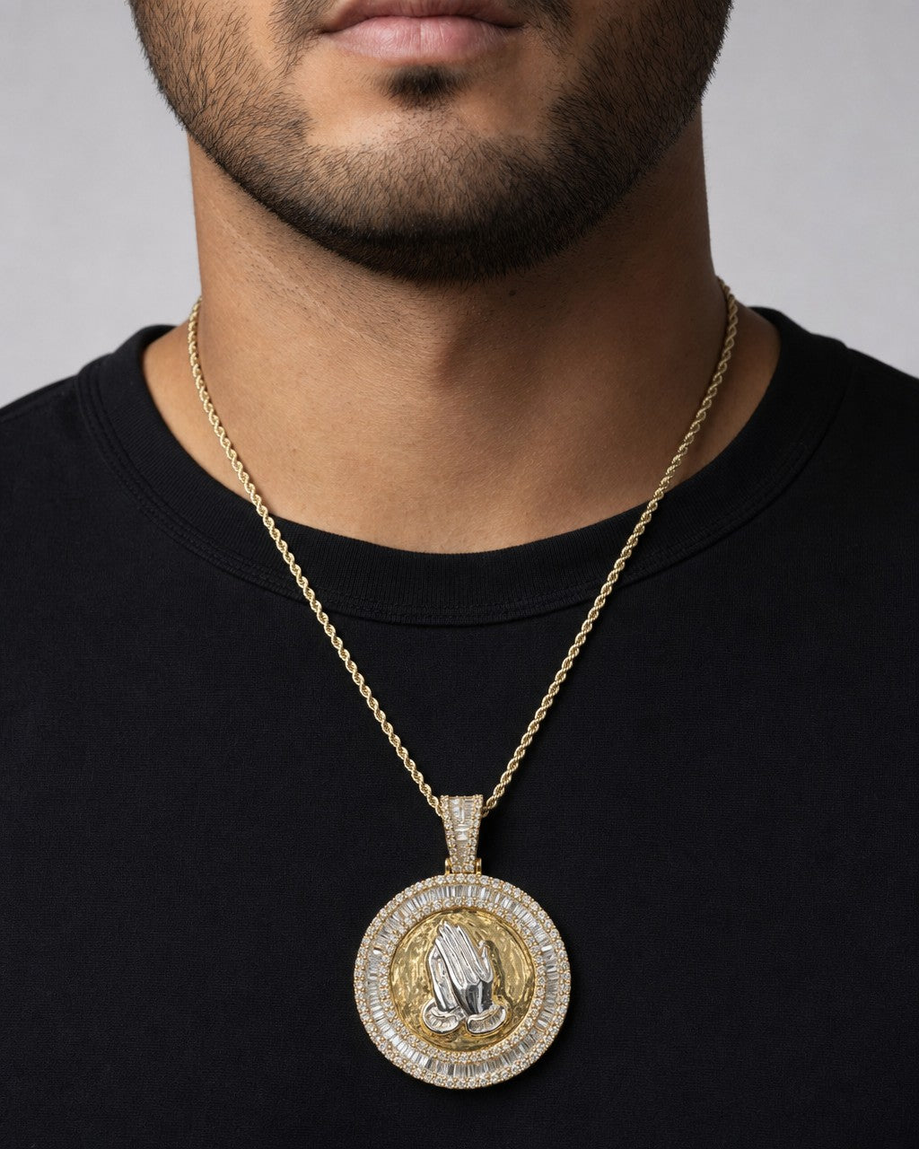Male model wearing 14K Praying Hands Diamond Baguette Pendant