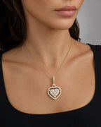 Female model wearing 14K Heart Diamond Baguette Gap Pendant