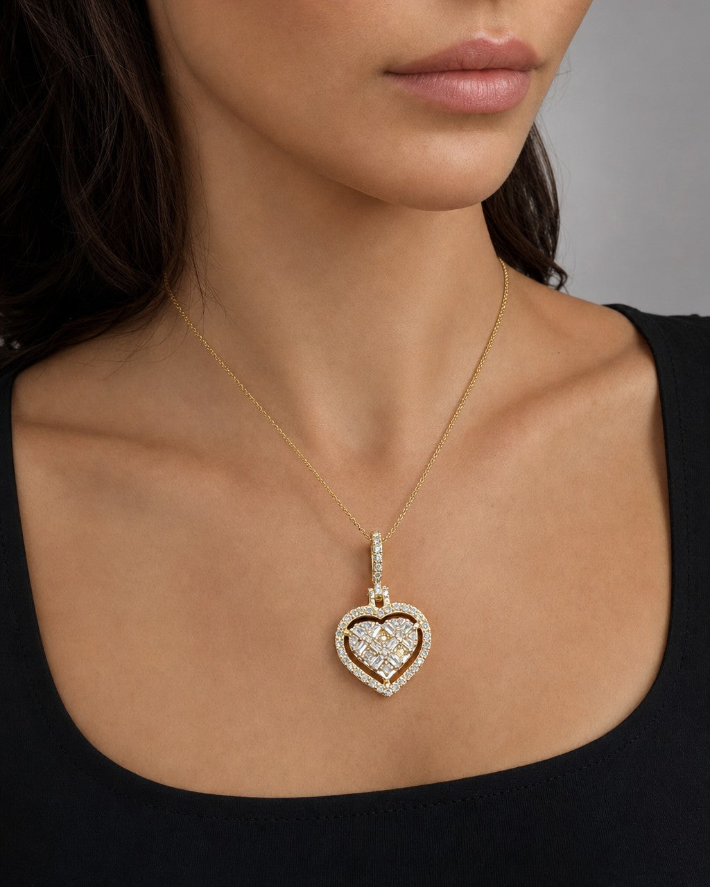 Female model wearing 14K Heart Diamond Baguette Gap Pendant