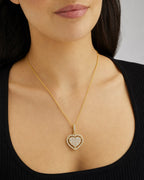 Female model wearing 14K Heart Diamond Baguette Gap Pendant