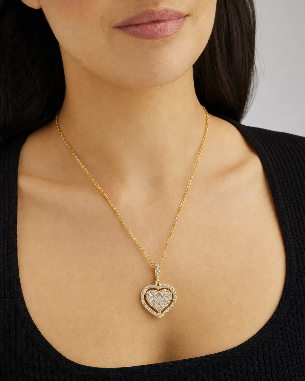 Female model wearing 14K Heart Diamond Baguette Gap Pendant