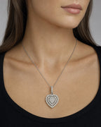 Female model wearing 14K Heart Ripple Diamond Pendant