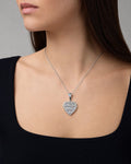 Female model wearing 14K Heart Diamond Baguette Pendant