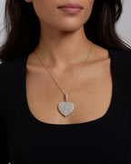 Female model wearing 14K Heart Diamond Pendant