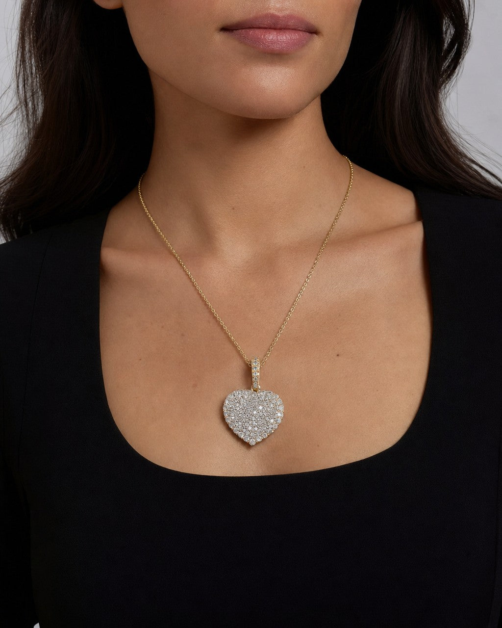 Female model wearing 14K Heart Diamond Pendant