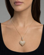Female model wearing 14K Heart Diamond Pendant