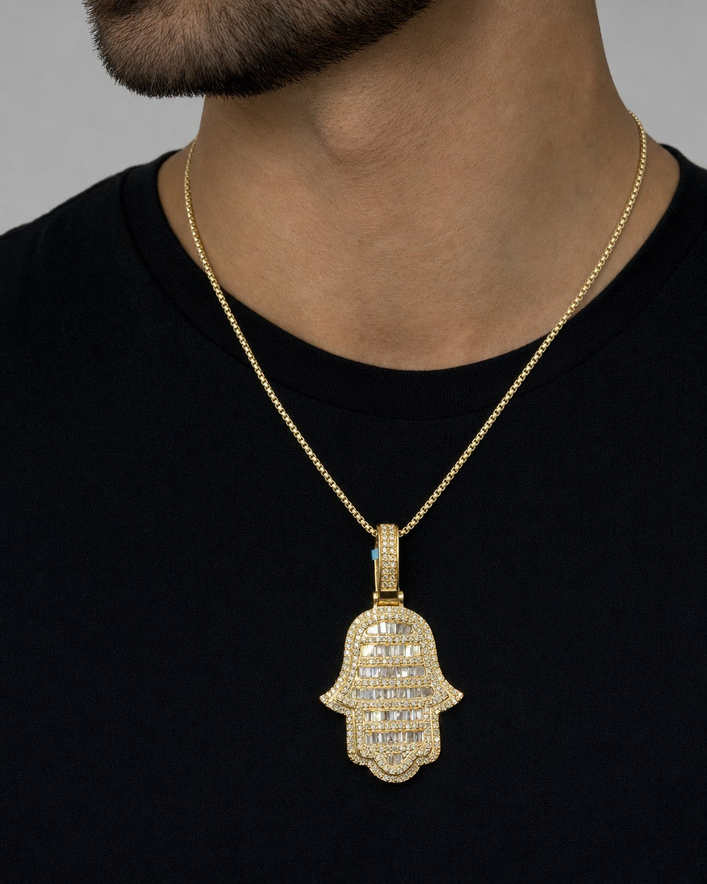 Male model wearing 14K Hamsa Solid Diamond Baguette Pendant